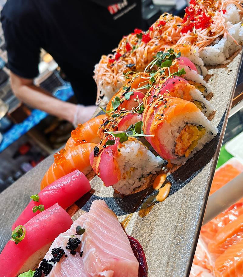 Fresh sashimi and sushi rolls plated at Nori