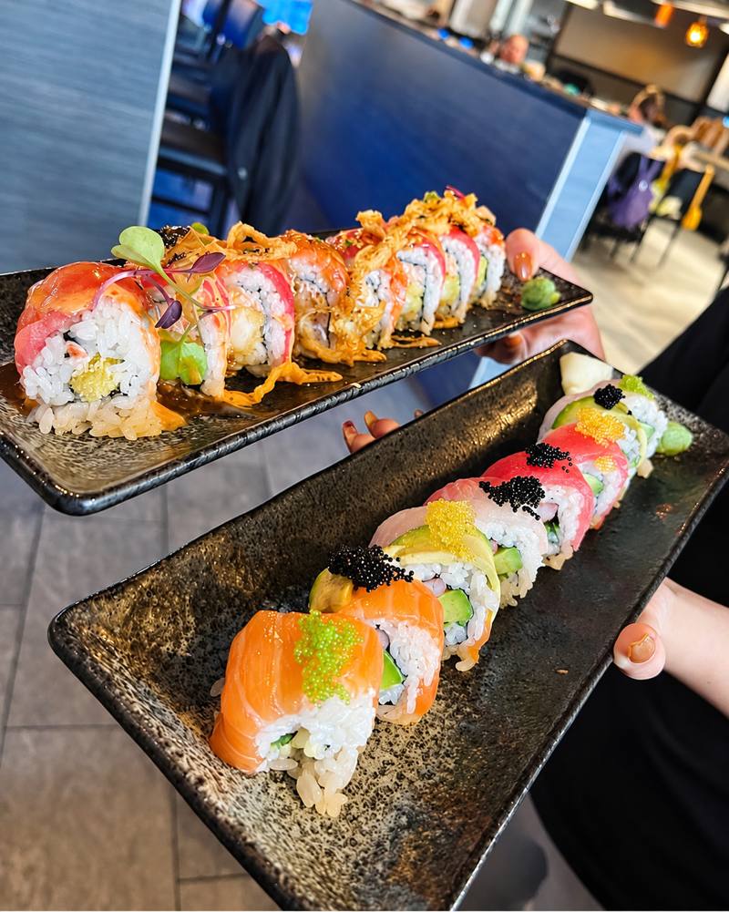 Two signature rolls topped with fish roe and crispy shallots